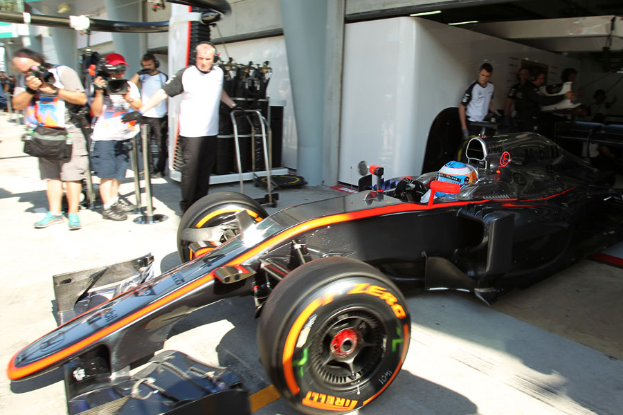 Fernando Alonso leaves the garage in the McLaren for the first time at a race weekend