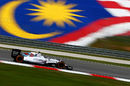 Valtteri Bottas drives past the colours of the Malaysian flag on Friday