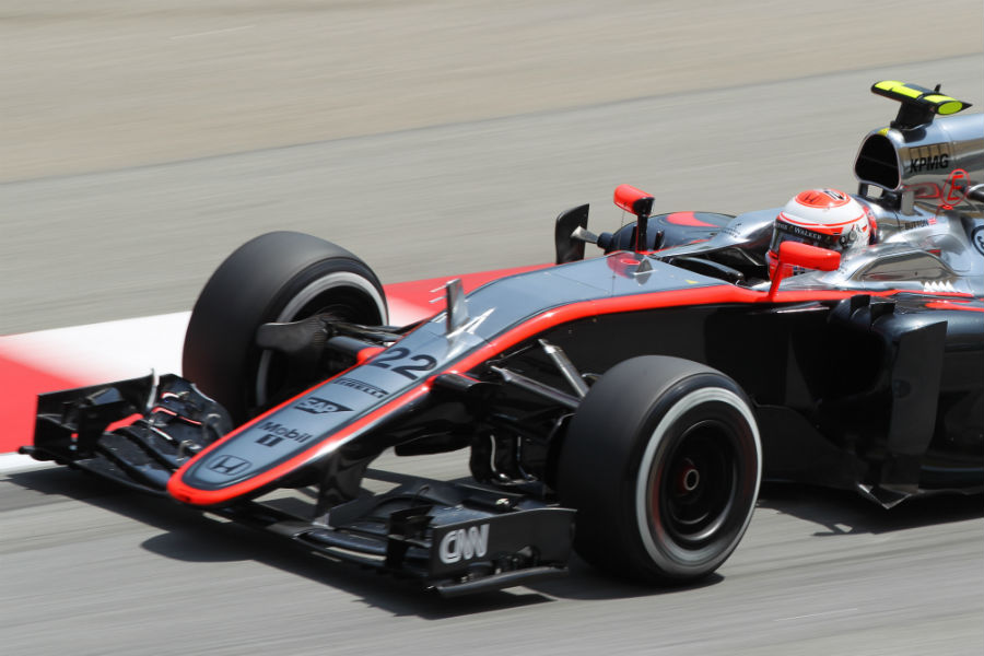 Jenson Button on track in the McLaren MP4-30