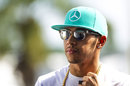 Lewis Hamilton arrives in the paddock on race day