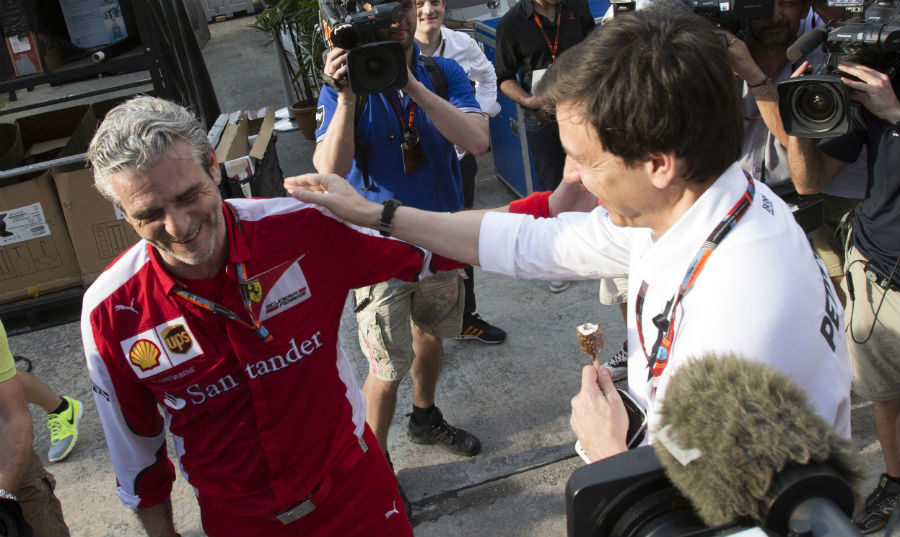 Mercedes boss Toto Wolff congratulates Ferrari counterpart Maurizio Arrivabene on the team's win in Malaysia