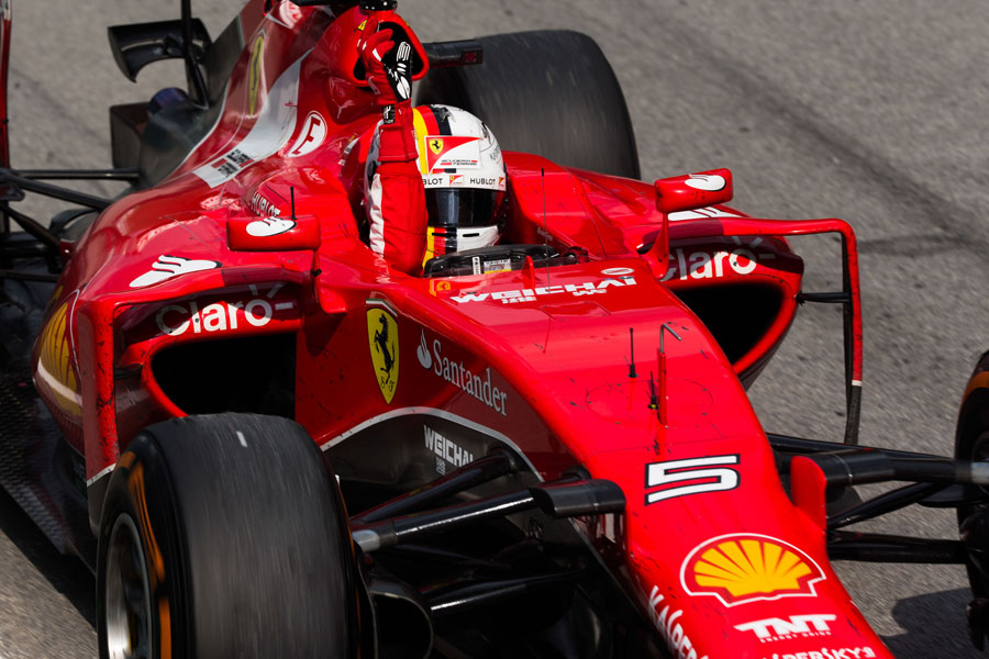 Sebastian Vettel crosses the line for victory