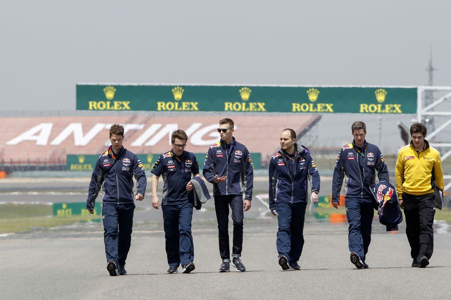 Kvyat walks the track with engineers