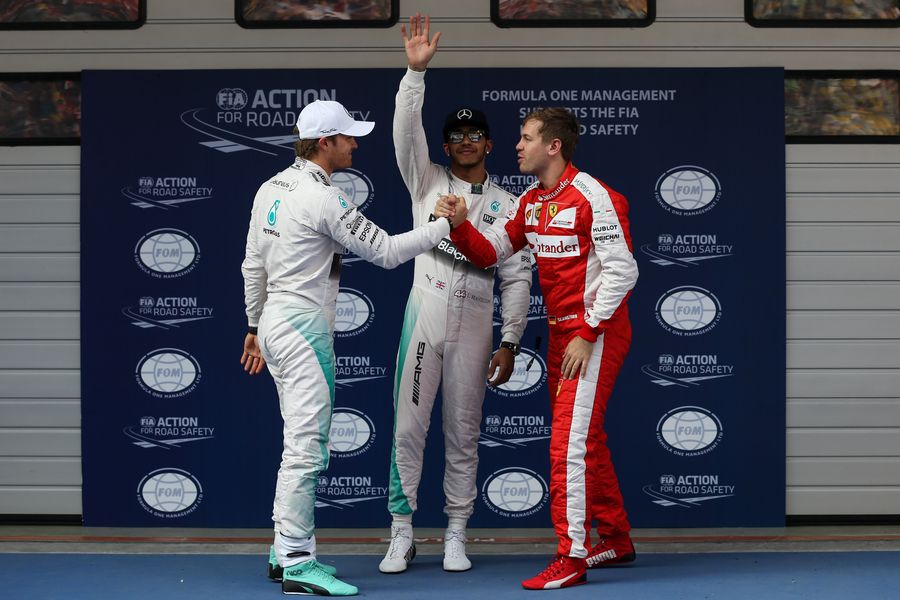 Sebastian Vettel congratulates Nico Rosbergafter qualifying