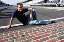 American driver Scott Speed poses with the famous Indy 