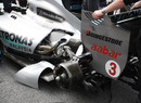 The exhaust covers are taken off the Mercedes prior to the race