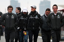 Michael Schumacher, Nico Rosberg and the Mercedes team walk the circuit