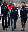 Rubens Barrichello is well wrapped up as he walks the circuit