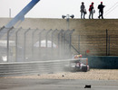 Sebastien Buemi crashes into the barriers at the end of the straight 
