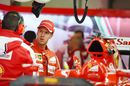 Sebastian Vettel chats with Ferrari engineers