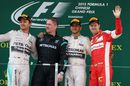 Race-winner Lewis Hamilton celebrates on the podium