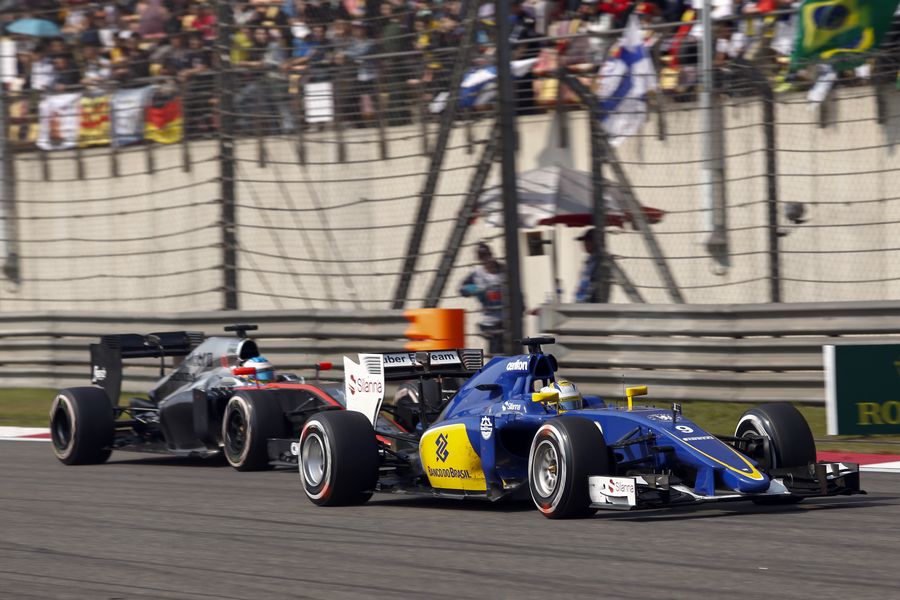 Marcus Ericsson leads Jenson Button