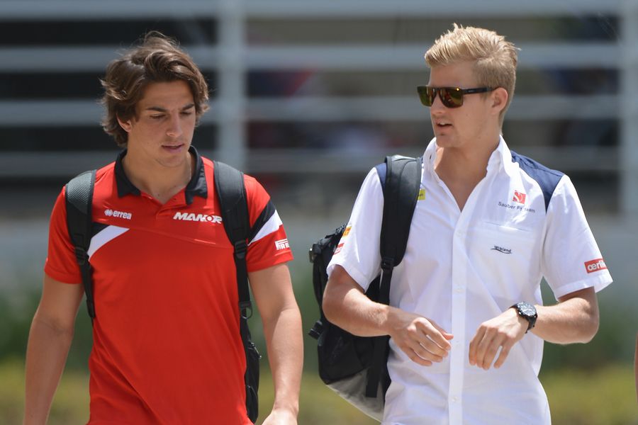 Roberto Merhi and Marcus Ericsson arrive at the circuit