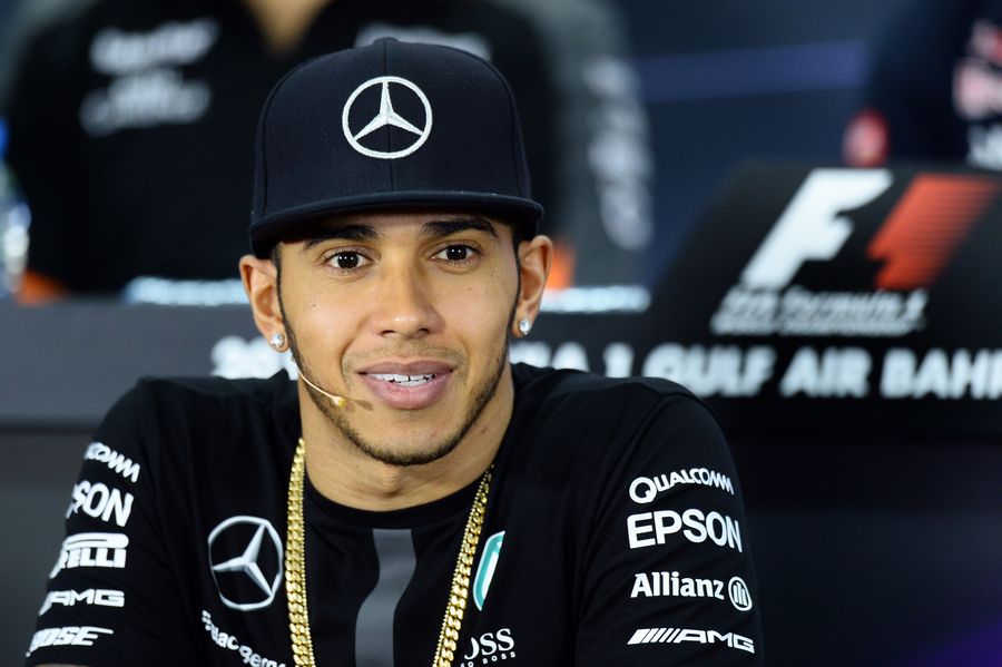 Lewis Hamilton looks on in the Thursday press conference