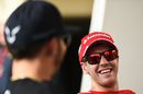 Sebastian Vettel laughs during the cat with Lewis Hamilton