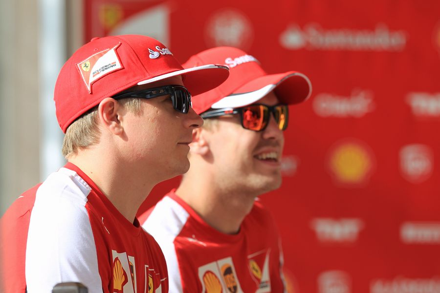 Kimi Raikkonen and Sebastian Vettel in the paddock