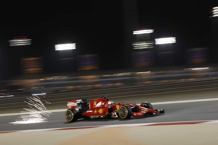 Sparks fly from Sebastian Vettel's Ferrari