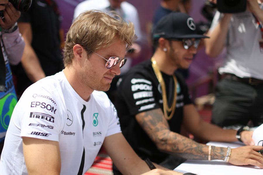Nico Rosberg signs autographs for the fans