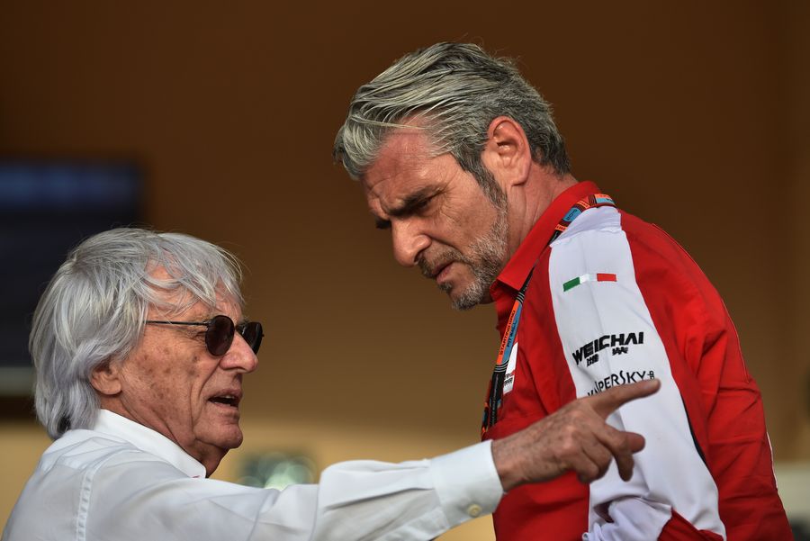 Bernie Ecclestone chats with Maurizio Arrivabene in the paddock