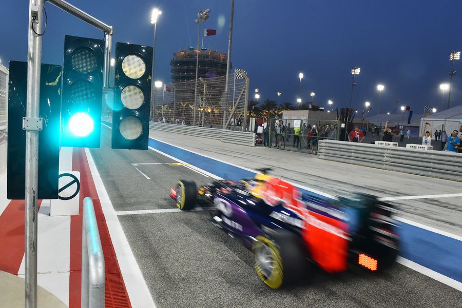 Daniil Kvyat makes his way down the pit lane