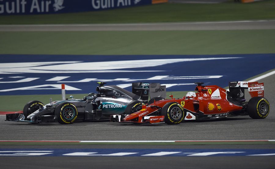 Nico Rosberg passes Sebastian Vettel at Turn 1