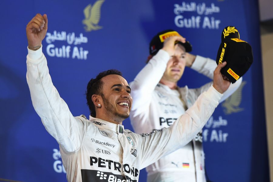 Lewis Hamilton celebrates his victory on the podium
