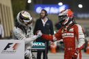 Kimi Raikkonen congratulates Race-winner Lewis Hamilton in parc ferme