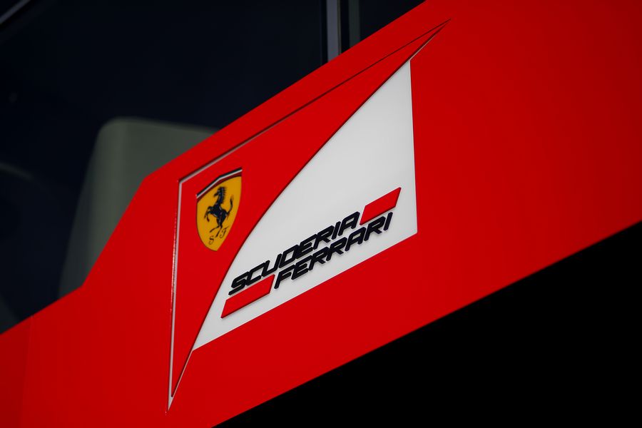 The Ferrari logo in the paddock