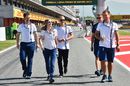 Susie Wolff and Valtteri Bottas share a laugh while waling the track
