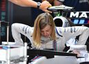 Susie Wolff climbs in of the cockpit of the Williams