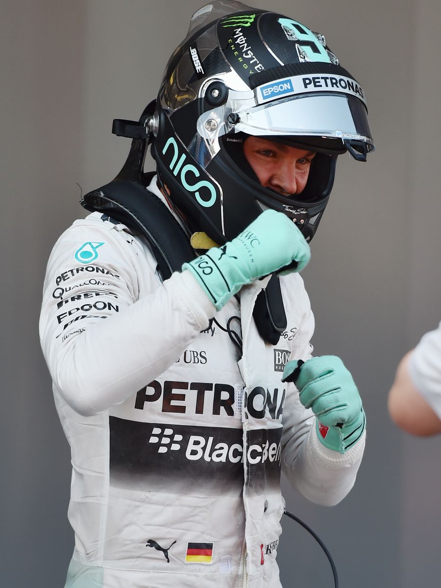 Nico Rosberg gestures to the cameras after clinching pole
