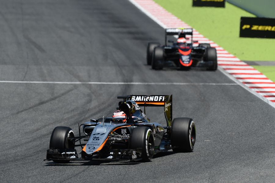 Nico Hulkenberg gets the power down in the Force India