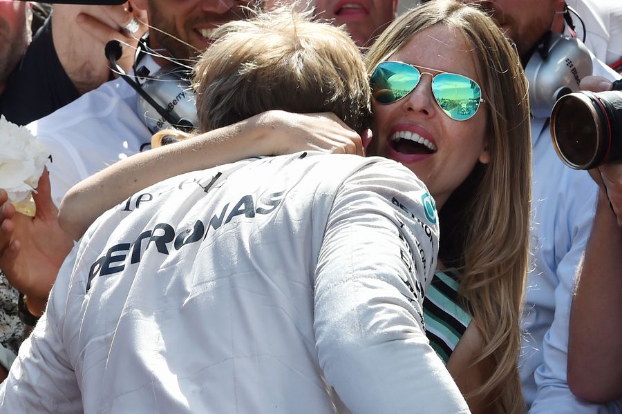 Race winner Nico Rosberg celebrates with his wife Vivian Sibold in parc ferme