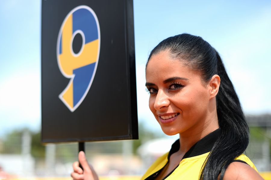 A grid girl poses ahead of the race
