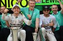 Race winner Nico Rosberg and Lewis Hamilton celebrate with the team
