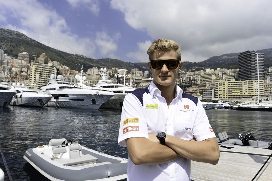 Marcus Ericsson poses at the harbour