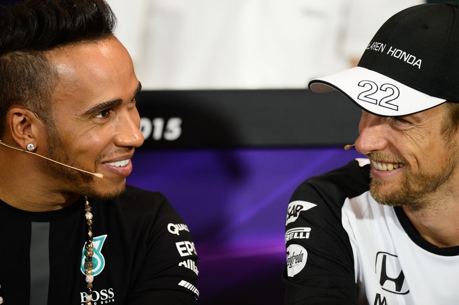 Lewis Hamilton and Jenson Button share a joke at the press conference