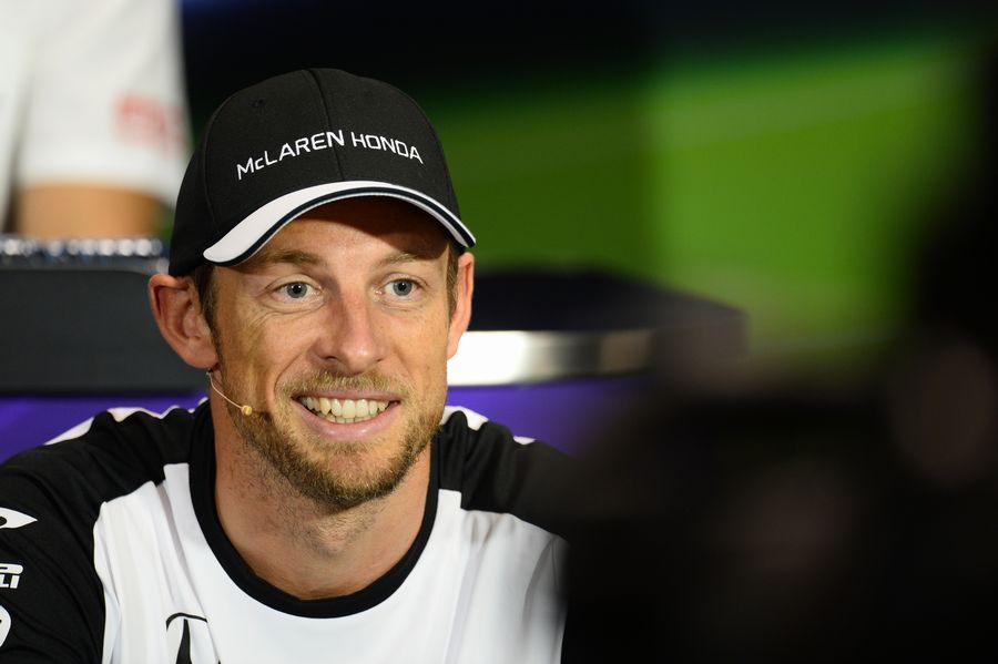 Jenson Button answers questions from media in the press conference
