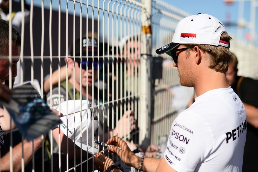 Nico Rosberg signs autographs for fans