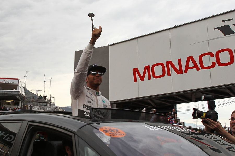 Lewis Hamilton celebrates his first pole in Monaco