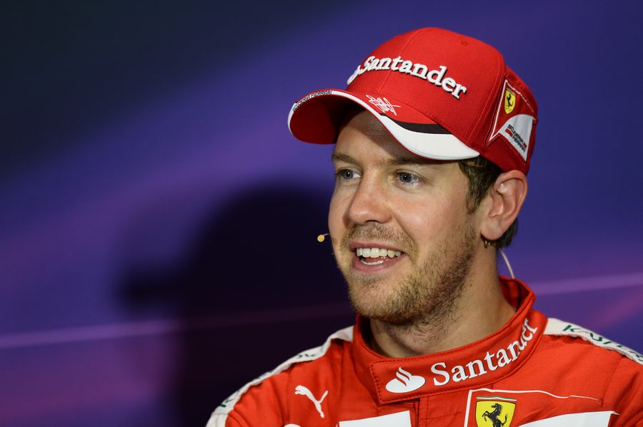 Sebastian Vettel smiles during the press conference