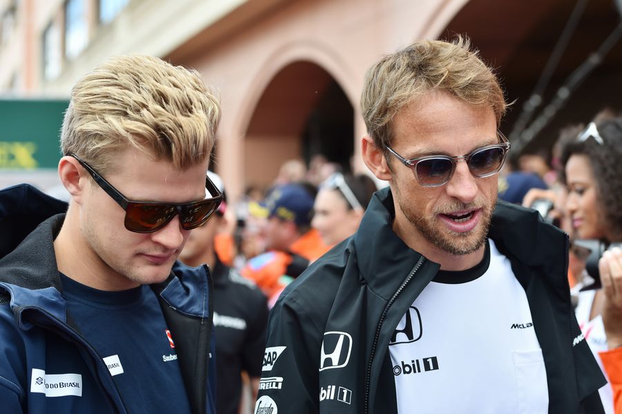 Marcus Ericsson and Jenson Button chat ahead of the drivers parade