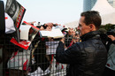 Michael Schumacher signs autographs for fans