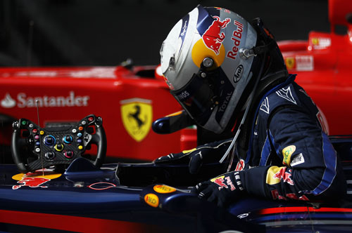 Sebastian Vettel gets out of his car after claiming pole