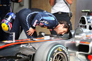 Mark Webber takes a closer look at the McLaren's cockpit