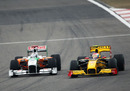 Adrian Sutil battles with Vitaly Petrov