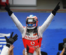 Jenson Button celebrates after his win