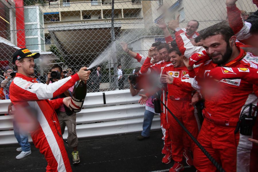 Sebastian Vettel celebrates with the champagne 