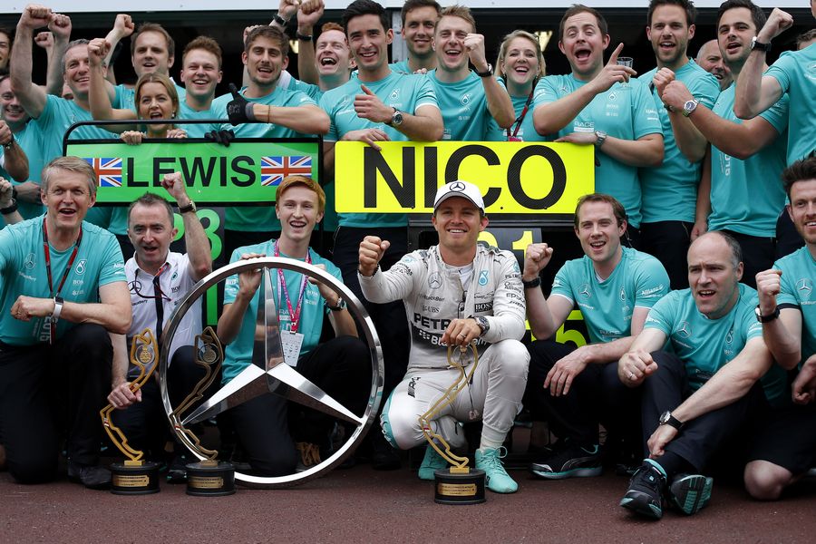 Nico Rosberg celebrates his win with Mercedes members