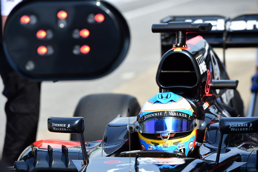 Fernando Alonso makes a pit stop